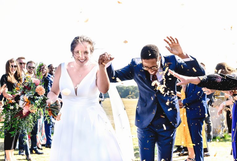 Bride and groom confetti shot at Pylewell Park wedding venue in Hampshire